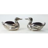 Two silver coloured metal mounted DUCK pin cushions. Circa 1900-1920, 9.5cm wide approx.
