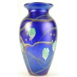 Okra art glass vase decorated with iridescent floral design,