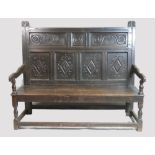 18th century oak carved panelled settle,