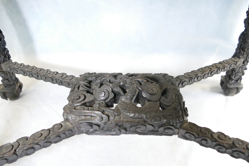 A 19th century Chinese dark wood centre table, the elaborate frieze and stretcher, - Image 2 of 2