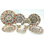 A collection of Royal Crown Derby in the 1128 Imari design comprising dinner plates,