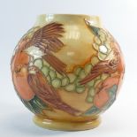 Moorcroft vase decorated in the Finch & Berry design on light brown ground,