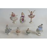A collection of Dresden porcelain small and miniature figures of dancing girls with floral lace