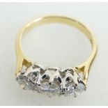 18ct Three Stone Diamond Ring, 0.50ct plus 2 x .25ct (1ct total) size N1/2 approx.