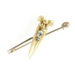 Yellow metal brooch set with two old cut diamonds, 2.