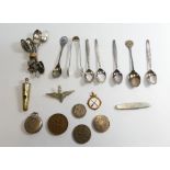 A collection of collectable items including silver spoons (88 grams),