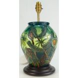 Moorcroft Lampbase decorated in the Amazon Twilight design, height 25.5cm on wooden plinth.