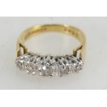 18ct gold ring set with five diamonds, size K, 4.3 grams.