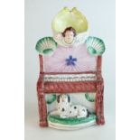 19th century Staffordshire flat back figure of a piano with angel watch holder and dog underneath,