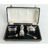 Silver 3 piece cruet set, cased. Clear hallmarks for Birmingham 1955. 164.7g.