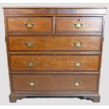 Early 19th century oak chest of drawers, the drawers cross banded in mahogany (cut in half).