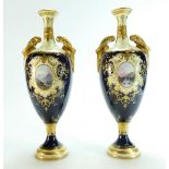 Pair Coalport two handled vases gilded & hand painted with panels of lake,