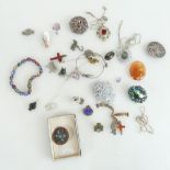 A collection of vintage jewellery including many silver brooches, bracelets,