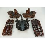 A pair of 19th/20th Century Chinese wood carvings of boys on the back of water buffalo (the water