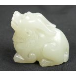 Ming Dynasty (1368-1644) A Chinese white Jade figure of a Qilin, length 3.