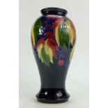 Walter Moorcroft vase decorated in the Leaf and Berry design, height 23cm.