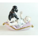 Sitzendorf porcelain figure of baby on a cushion with a poodle dog,