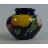 Moorcroft small vase decorated in the Wisteria design,