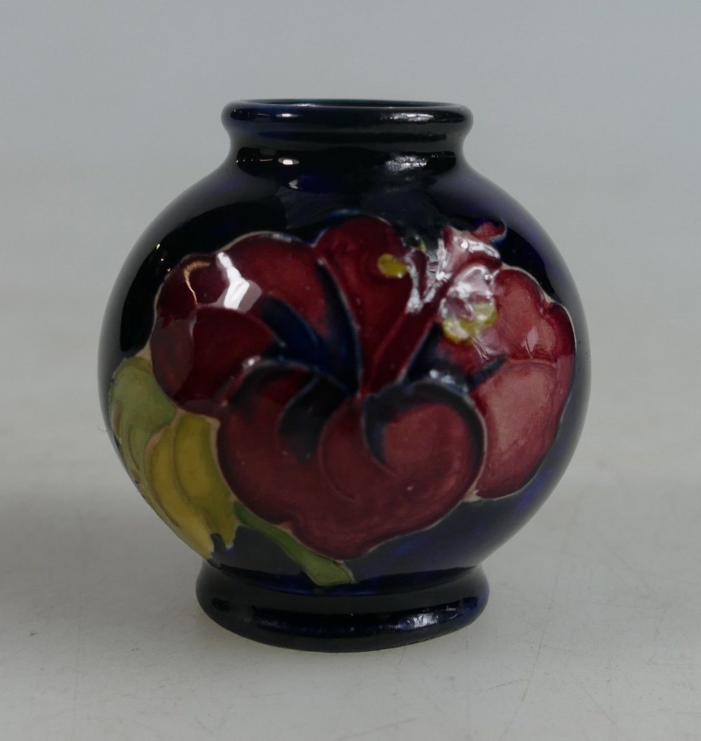 Moorcroft miniature vase decorated in the Hibiscus design, height 5cm.