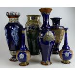 A collection of Royal Doulton Lambeth stoneware vases comprising a pair of vases and four other