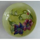 Moorcroft footed dish decorated in the Clematis design,