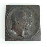 Carved wooden plaque depicting 2 figures bearing resemblance to Edward VII & Queen Alexandra 29cm x