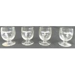 Four WWII Nazi / Luftwaffe shot glasses, with etched insignia, 7cm high. One damaged.