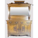 Art Nouveau carved oak two door mirror backed sideboard