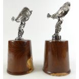 A pair of Rolls Royce Spirit of Ecstasy car mascots mounted on wooden plinths (2).