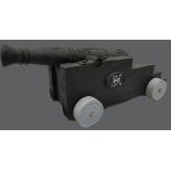 19th century cast iron ornate small cannon with later made wooden trolley, length of cannon 81cm.