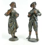 Pair of early 20th century spelter figures of lady withy bouquet of flowers and young man holding