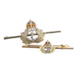 9ct gold Royal Navy pin brooch, 2.8 grams and a larger silver version (2).