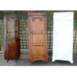 Twentieth century carved oak panelled single door wardrobe,