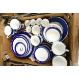 A collection of undecorated blue and white dinner and tea ware