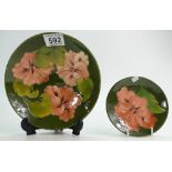 Moorcroft Hibiscus on green ground footed dish and small coaster (the larger item damaged - nip to