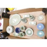 A collection of sage green Wedgwood items to include dressing table oval pin trays, vases,