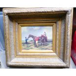 Reproduction printed painting of horse and rider in heavy gilt frame.