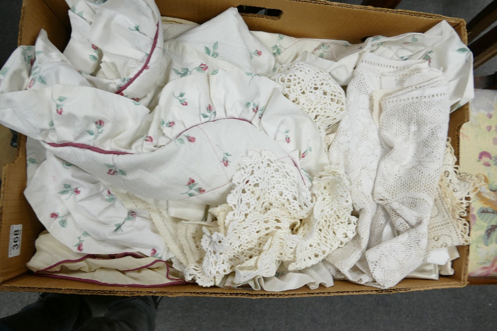 A mixed collection of vintage lace and embroidered items including tea towels, bed linen,