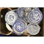 A collection of Staffordshire blue and white items to include serving platters, tureens,