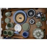 A collection of Wedgwood jasperware items to include sage green boxes, black on yellow pin trays,