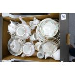 A collection of late 19th century hand decorated floral tea and dinnerware to include cups,