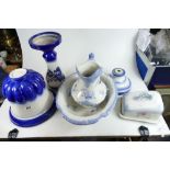 A collection of blue and white items to include modern water jug and bowl,