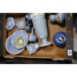 A collection of Wedgwood jasperware items to include mantle clocks, vases,