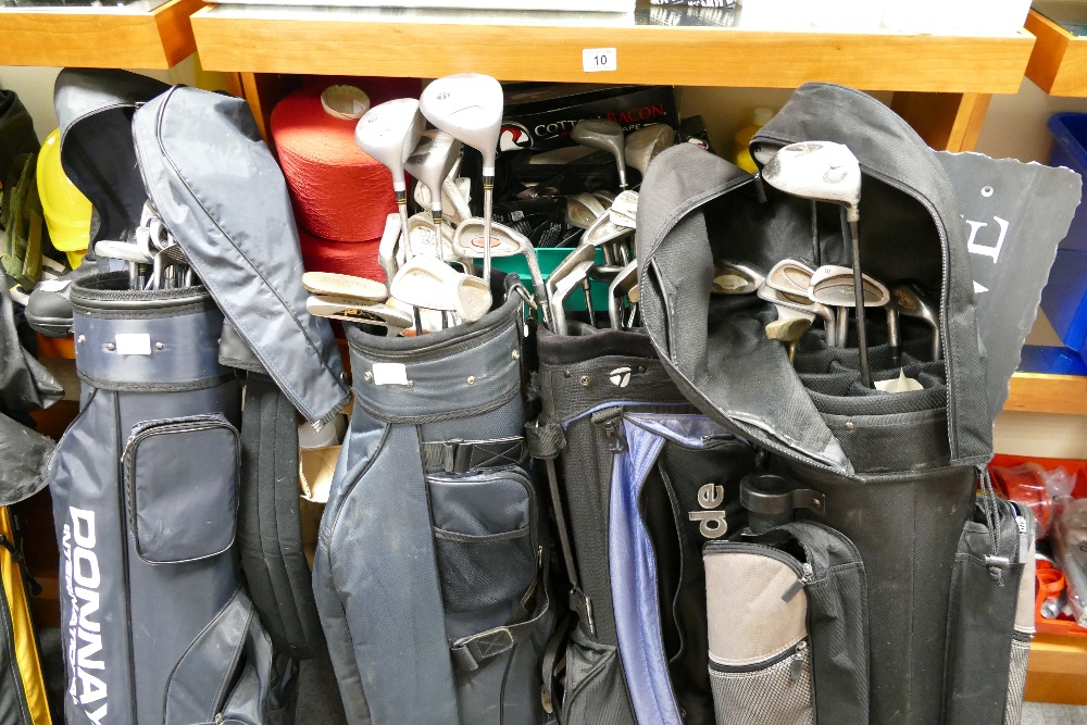 A large collection of golf clubs to include Donnay, Regal and Wilson,