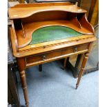 A reproduction walnut writing table with single drawer and pullout writing slide with green leather