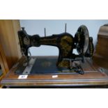 Jones sewing machine with heavy gilt decoration in travel case