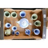 A collection of Wedgwood blue and green jasper ware consisting of money box, teapot, vases etc.