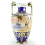 A Noritake large hand painted and gilded twin handled vase with desert scenes.