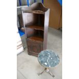 20th Century oak corner unit with 2 shaped shelves above a carved panel door,