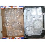 A large collection of pressed glass and lead crystal items to include water jugs, vases, decanters,